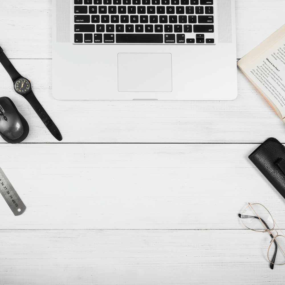 Clean and organized office desk with spotless windows in the background.